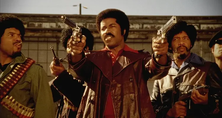 Black Dynamite 2009 Movie Scene Michael Jai White as Black Dynamite holding two Desert Eagle guns