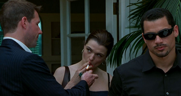 Confidence 2003 Movie Edward Burns lighting a cigarette for Rachel Weisz