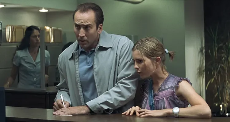 Matchstick Men 2003 Movie Scene Nicolas Cage as Roy Waller and Alison Lohman as Angela in a bank