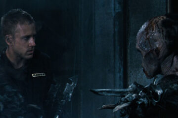 Pandorum 2009 Movie Scene Ben Foster as Bower looking at the mutant holding a spear through the force field