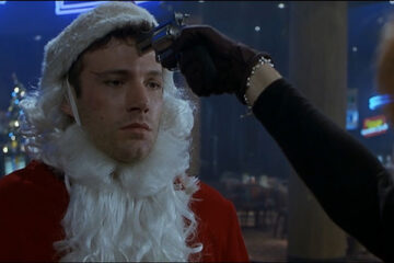 Reindeer Games 2000 Movie Scene Ben Affleck as Rudy dressed as a Santa with Charlize Theron as Ashley holding a gun to his head