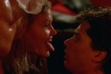Society 1989 Movie Scene Patrice Jennings as Jenny sticking out her tongue at Billy Warlock as Bill