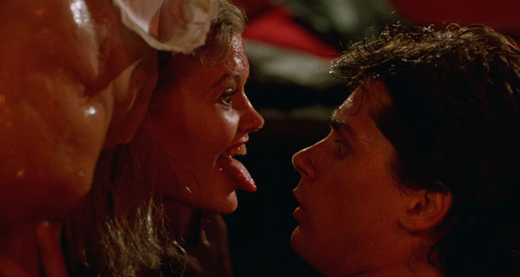 Society 1989 Movie Scene Patrice Jennings as Jenny sticking out her tongue at Billy Warlock as Bill