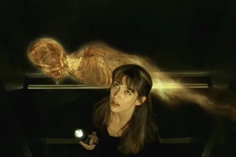 Belphegor Phantom of The Louvre 2001 Movie Scene Sophie Marceau as Lisa in an elevator with the mummy ghost Belphegor flying around her