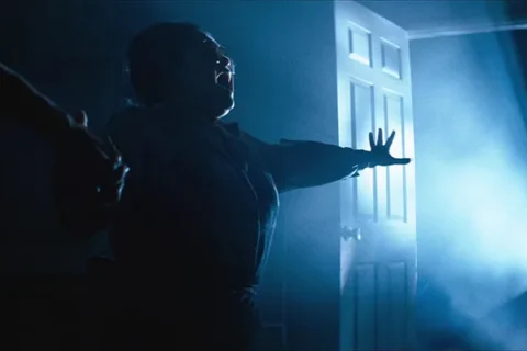 Poltergeist 1982 Movie Scene Zelda Rubinstein as Tangina trying to communicate with the spirits inside the house