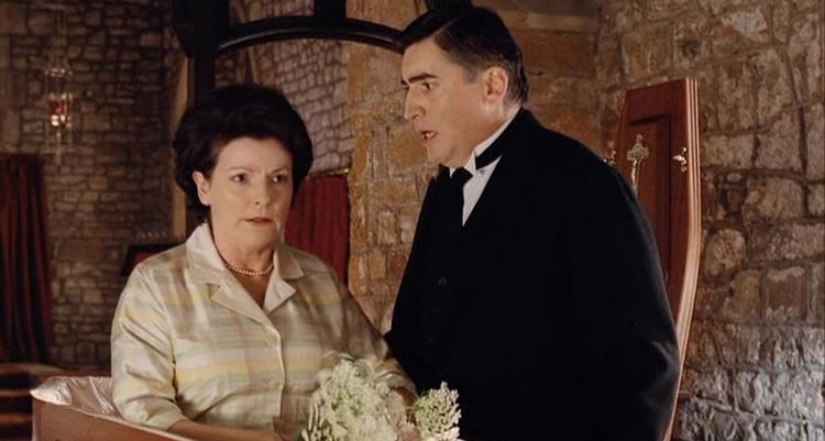Undertaking Betty AKA Plots With A View 2002 Movie Scene Alfred Molina as Boris talking to Brenda Blethyn as Betty at her funeral service while she's faking to be dead in a coffin