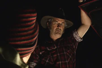 Wolf Creek 2005 Movie Scene John Jarratt as Mick Taylor opening the hood of the car in the night