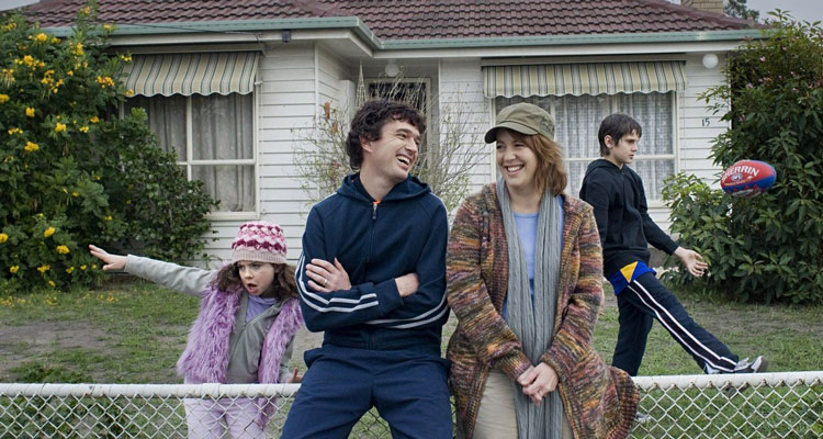 My Year Without Sex 2009 Scene Sacha Horler as Natalie and Matt Day as Ross standing in front of their house smiling