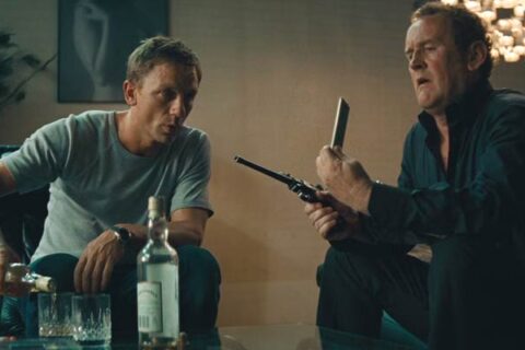Layer Cake 2004 Movie Scene Colm Meaney as Gene showing Daniel Craig as XXXX how to operate one of his ancient guns