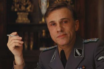 Inglourious Basterds 2009 Movie Scene Christoph Waltz as Hans Landa smoking a cigarette