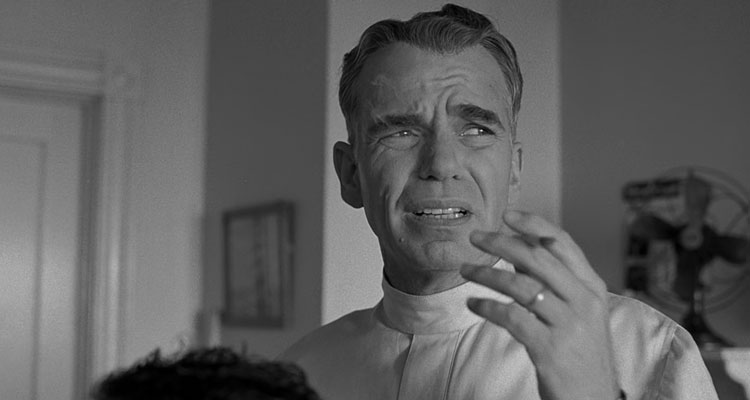 The Man Who Wasnt There 2001 Movie Scene Billy Bob Thornton as Ed Crane smoking a cigarette in his barbershop