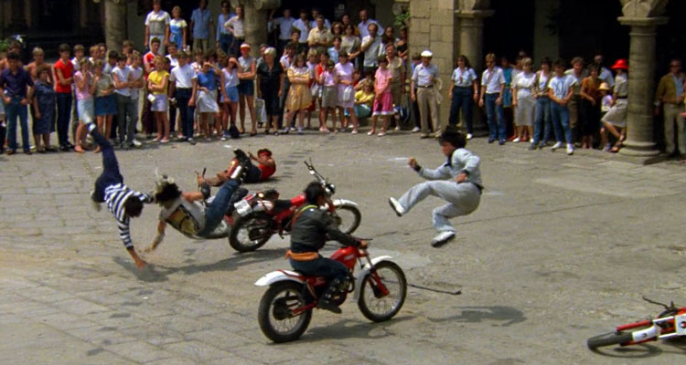 Wheels on Meals 1984 Movie Scene Jackie Chan as Thomas kicking a bad guy off a motorcycle