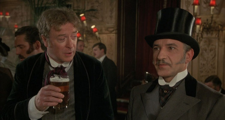 Without A Clue Movie 1988 Scene Michael Caine as Sherlock Holmes drinking beer and Ben Kingsley as Dr. John Watson in a pub