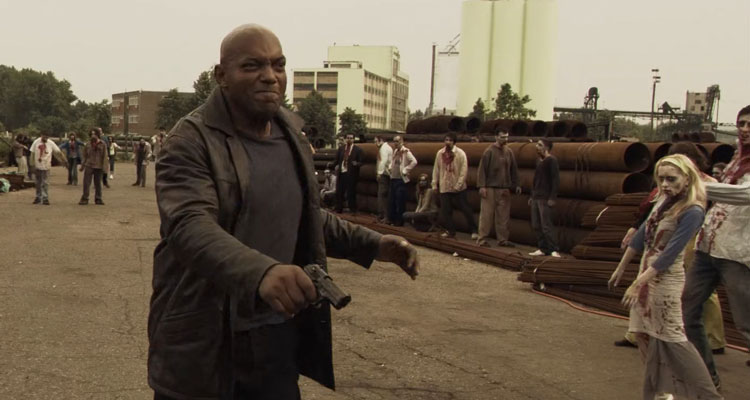 Zone of the Dead 2009 Movie Scene Ken Foree as Agent Mortimer Reyes fighting zombies at the train station