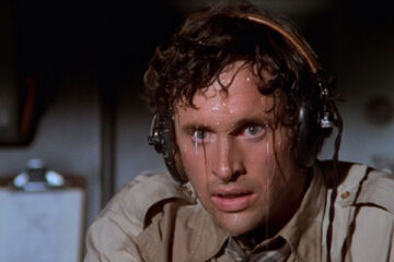Airplane 1980 Movie Scene Robert Hays as Ted Striker as the pilot who keeps sweating profusely with water pouring everywhere