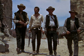 The Wild Bunch 1969 Movie Scene William Holden as Pike, Ernest Borgnine as Dutch, Warren Oates as Lyle Gorch and Ben Johnson as Tector Gorch walking into town holding rifles