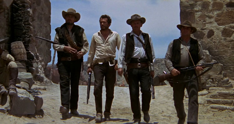 The Wild Bunch 1969 Movie Scene William Holden as Pike, Ernest Borgnine as Dutch, Warren Oates as Lyle Gorch and Ben Johnson as Tector Gorch walking into town holding rifles