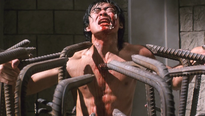 Riki Oh The Story of Ricky 1991 Movie Scene Siu-Wong Fan as Ricky trapped by rebar and tortured