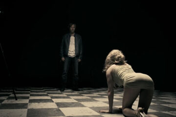 A Serbian Film 2010 Movie Scene A girl in short dress slowly crawling towards Milos played by Srdjan Zika Todorovic