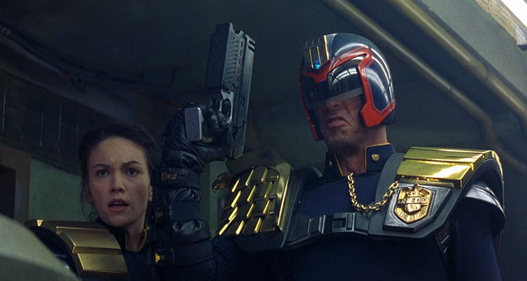 Judge Dredd 1995 Movie Scene Sylvester Stallone as Judge Dredd holding his gun with Diane Lane as Judge Hershey next to him