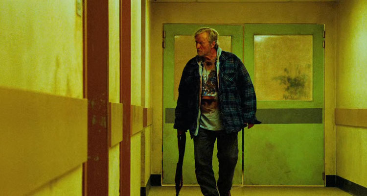 Hobo With A Shotgun 2011 Movie Scene Rutger Hauer as Hobo walking through the hospital holding a shotgun