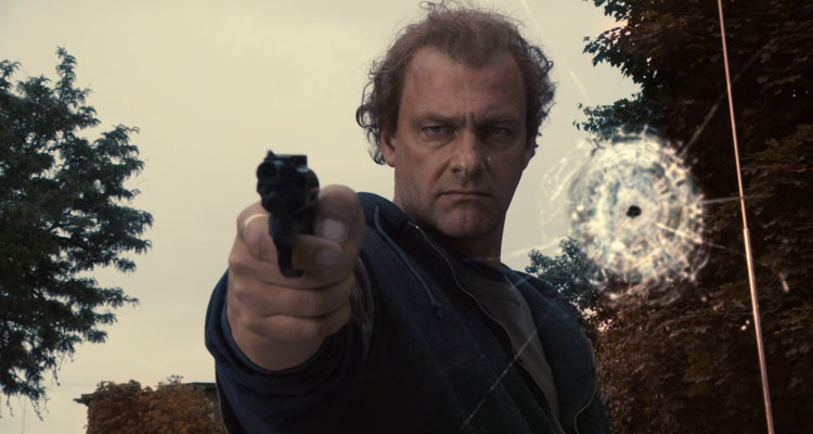 Kill The Irishman 2011 Movie Scene Ray Stevenson as Danny Greene holding a gun