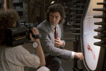 The Fly 1986 Movie Scene Jeff Goldblum as Seth Brundle looking at his teleportation pod with blood on it