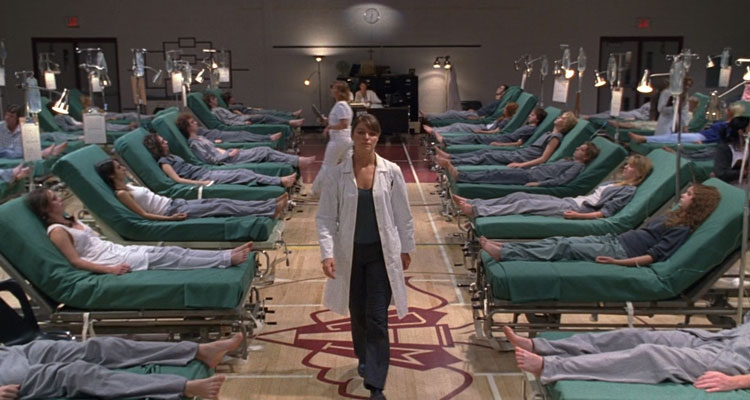 The Plague 2006 Movie Scene Ivana Milicevic as Dr. Jean walking among dozens of kids in coma