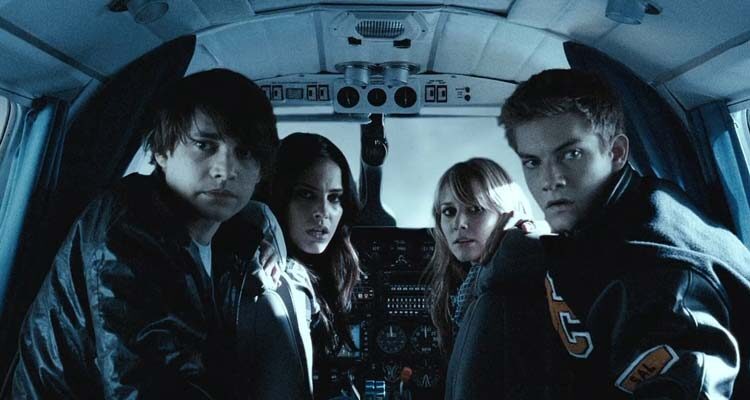 Altitude 2010 Movie Scene Jessica Lowndes as Sara, Julianna Guill as Mel, Ryan Donowho as Cory and Landon Liboiron as Bruce looking at the back of the airplane