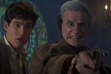 Fright Night 1985 Movie Scene William Ragsdale as Charley and Roddy McDowall as Peter Vincent fighting vampires