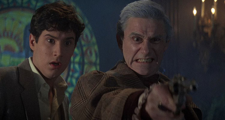 Fright Night 1985 Movie Scene William Ragsdale as Charley and Roddy McDowall as Peter Vincent fighting vampires