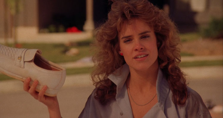 Night of the Comet 1984 Movie Scene Catherine Mary Stewart as Regina Reggie Belmont holding a shoe full of red dust