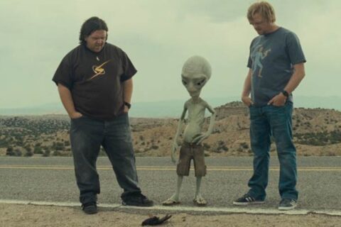 Paul 2011 Movie Scene Simon Pegg as Graeme, Nick Frost as Clive and Seth Rogen as Paul, the alien standing next to a road and looking at a dead bird