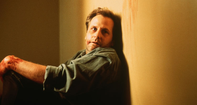 Chasing Sleep 2000 Movie Scene Jeff Daniels as Ed Saxon sitting in hallway with an empty glare in his eyes after suffering from insomnia for a few days