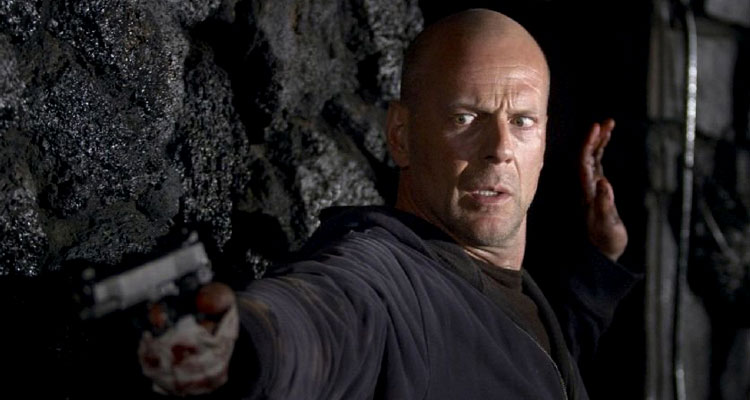 Hostage 2005 Movie Scene Bruce Willis as Jeff Talley holding a gun and leaning on a wall