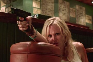 Catch 44 2011 Movie Scene Malin Akerman as Tes holding a gun in the diner