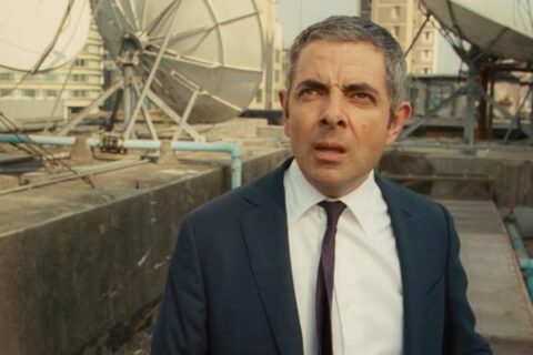 Johnny English Reborn 2011 Movie Scene Rowan Atkinson as Johnny English on top of a building