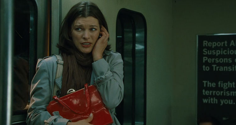 Faces in the Crowd 2011 Movie Scene Milla Jovovich as Anna Marchant in a train after seeing the killer