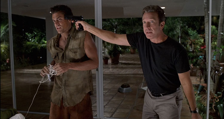 Big Trouble 2002 Movie Scene Tim Allen as Eliot holding a gun to Johnny Knoxville as Eddie's head