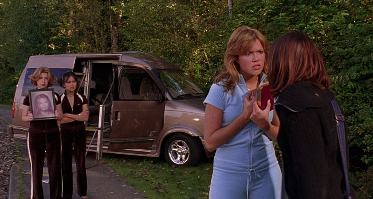 Saved! 2004 Movie Scene Mandy Moore as Hilary holding a bible and talking to Jena Malone as Mary