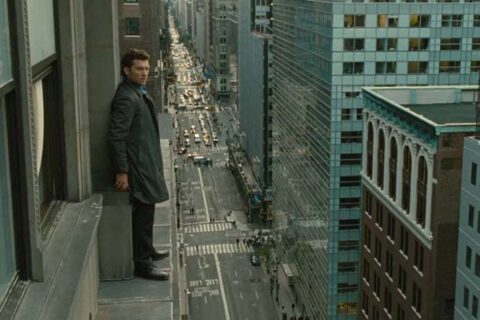 Man on a Ledge 2012 Movie Scene Sam Worthington as Nick Cassidy standing on the edge of a building in Manhattan threatening to jump