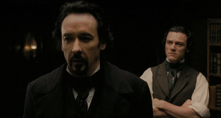 The Raven 2012 Movie Scene John Cusack as Edgar Allan Poe and Luke Evans as Detective Fields