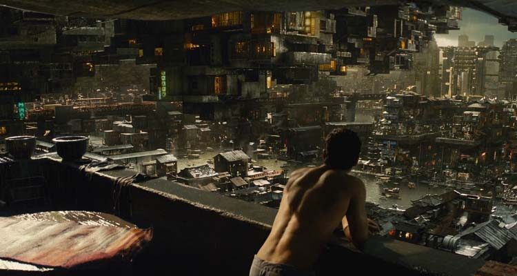 Total Recall 2012 Movie Scene Colin Farrell as Douglas Quaid drinking coffee on his terrace while watching the city around him