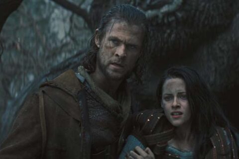 Snow White and the Huntsman 2012 Movie Scene Chris Hemsworth as The Huntsman and Kristen Stewart as Snow White in the dark forest