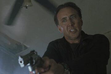 Stolen 2012 Movie Scene Nicolas Cage as Will holding a gun and looking for his daughter