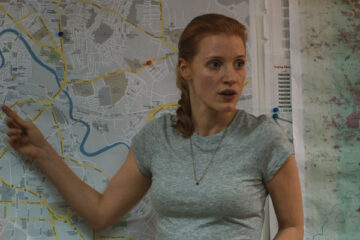 Zero Dark Thirty 2012 Movie Scene Jessica Chastain as Maya pointing on the map where she thinks Osama bin Laden is hiding