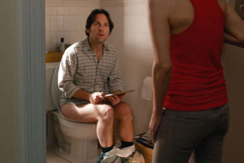 This is 40 2012 Movie Scene Paul Rudd as Pete in the toilet with his tablet looking for some peace and quiet