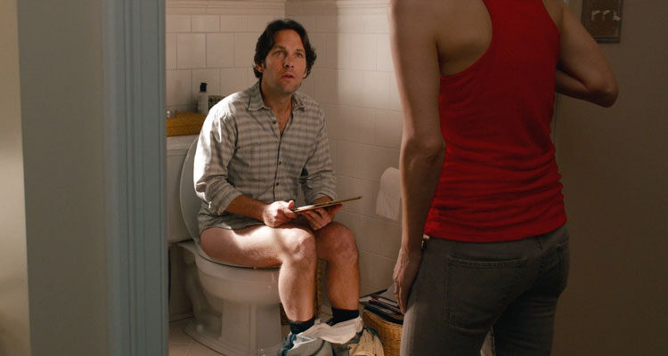 This is 40 2012 Movie Scene Paul Rudd as Pete in the toilet with his tablet looking for some peace and quiet