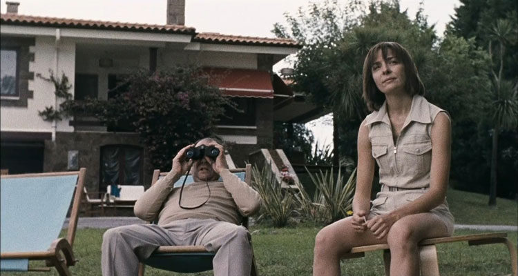 Timecrimes 2007 Movie Scene Karra Elejalde as Héctor watching his neighbors through his binoculars with Candela Fernández as Clara