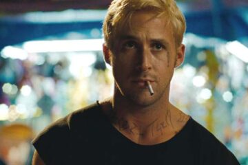 The Place Beyond The Pines 2012 Movie Scene Ryan Gosling as Luke, a bank robber with tattoos on his face, blonde hair and smoking a cigarette